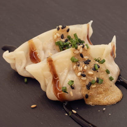 Perol Butifarra Gyoza, caramelized onion with porcini sauce